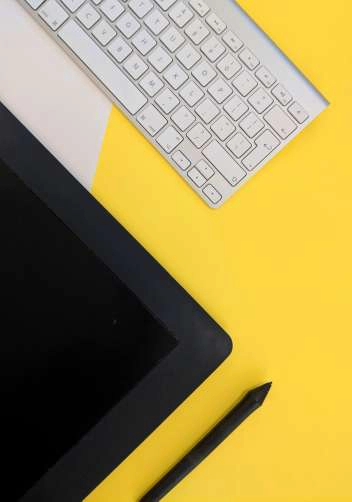 Keyboard on a yellow desk